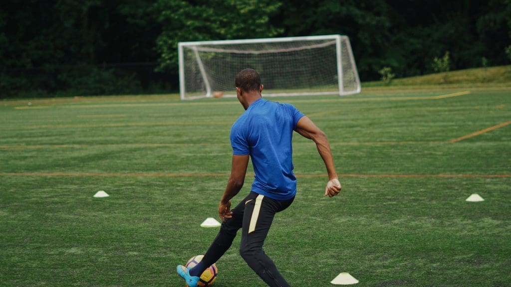 young man playing football