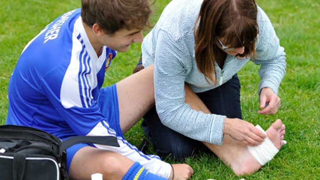 first aid being administered to a footballer