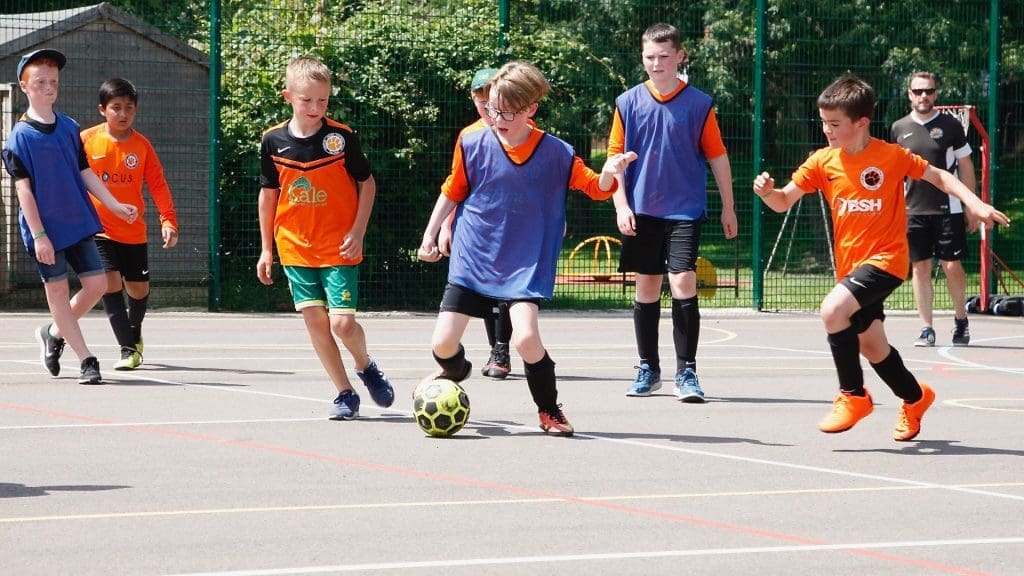 children playing futsall