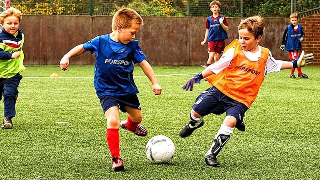 kids playing football